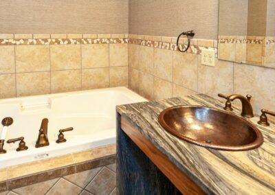 Copper Bathroom Sink And Stone Countertop
