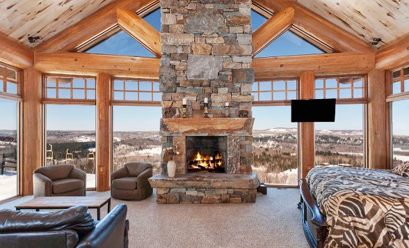 Custom Log Cabin Bedroom With Fireplace Windows