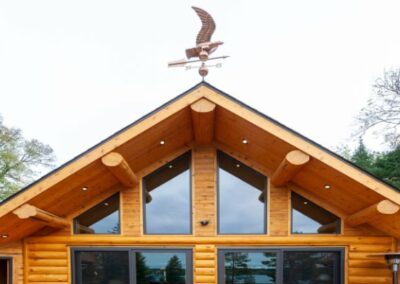 Log Home Roof Line With Weathervane