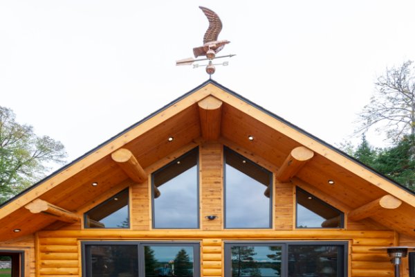 Log Home Roof Line With Weathervane
