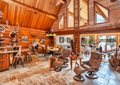 Magnificent Log Home Great Room With Game Trophies