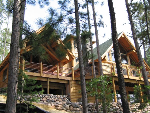 Towring Log Home Decks Overlooking Nature